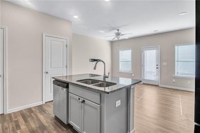 This beautifully maintained 3-bedroom, 2.5-bath townhome in the on Browns Mill Golf Course in Georgia - for sale on GolfHomes.com, golf home, golf lot