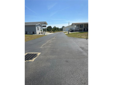 ******PRICE IMPROVEMENT******THIS *RV PORT* LOT IS LOCATED IN on Lily Lake Golf and RV Resort in Florida - for sale on GolfHomes.com, golf home, golf lot
