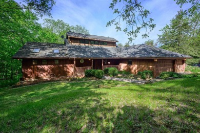 Tucked into the wooded hillside at the end of long ascending on Eagle Ridge Inn and Resort in Illinois - for sale on GolfHomes.com, golf home, golf lot