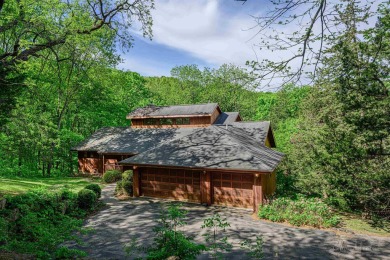 Tucked into the wooded hillside at the end of long ascending on Eagle Ridge Inn and Resort in Illinois - for sale on GolfHomes.com, golf home, golf lot