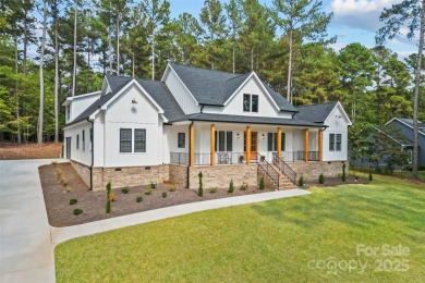This recently built modern farmhouse (2024) still looks brand on Granada Farms Country Club in North Carolina - for sale on GolfHomes.com, golf home, golf lot
