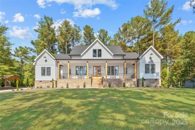 This recently built modern farmhouse (2024) still looks brand on Granada Farms Country Club in North Carolina - for sale on GolfHomes.com, golf home, golf lot