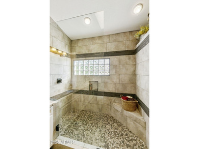 Nestled in a vibrant gated active adult community, this stunning on Palo Verde Golf and Country Club in Arizona - for sale on GolfHomes.com, golf home, golf lot