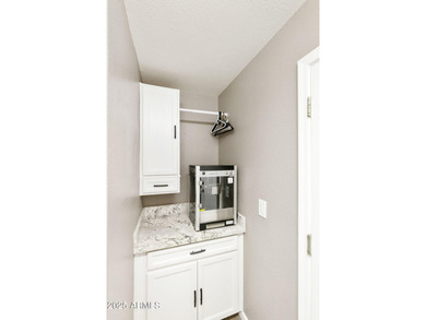 Nestled in a vibrant gated active adult community, this stunning on Palo Verde Golf and Country Club in Arizona - for sale on GolfHomes.com, golf home, golf lot