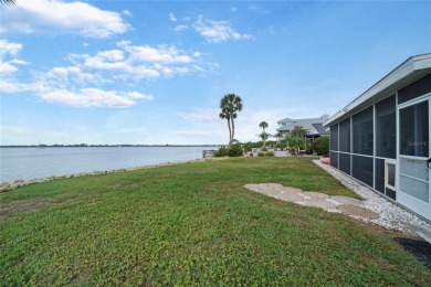 Impeccable waterfront property tucked in an alcove on Lemon Bay on Boca Royale Golf and Country Club in Florida - for sale on GolfHomes.com, golf home, golf lot