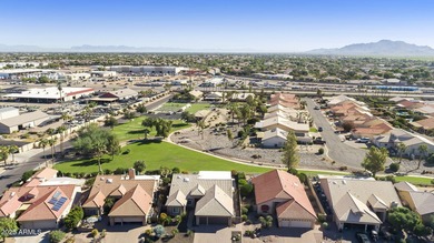 Nestled in a vibrant gated active adult community, this stunning on Palo Verde Golf and Country Club in Arizona - for sale on GolfHomes.com, golf home, golf lot