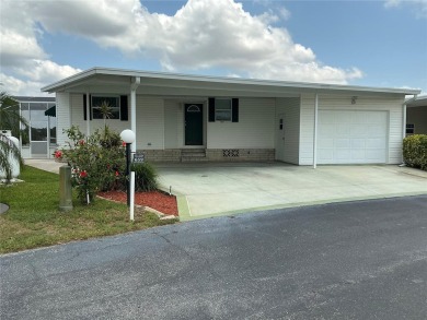 This 2/2 Palm Harbor manufactured home is nestled in a serene on Lily Lake Golf and RV Resort in Florida - for sale on GolfHomes.com, golf home, golf lot
