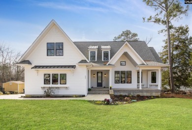 Discover the perfect blend of timeless craftsmanship and modern on Timberlake Country Club in South Carolina - for sale on GolfHomes.com, golf home, golf lot