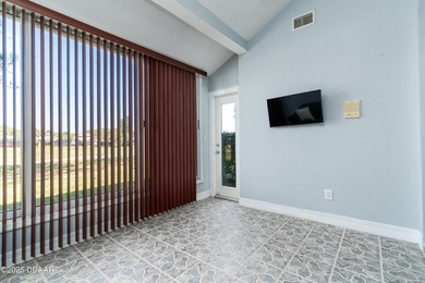 Experience the essence of refined Florida living in this on Spruce Creek Golf Club in Florida - for sale on GolfHomes.com, golf home, golf lot