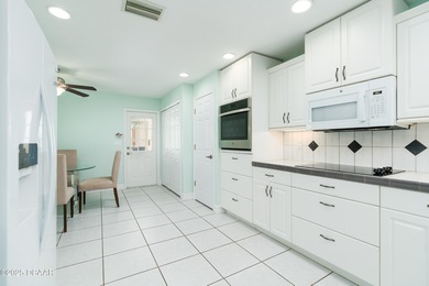 Experience the essence of refined Florida living in this on Spruce Creek Golf Club in Florida - for sale on GolfHomes.com, golf home, golf lot