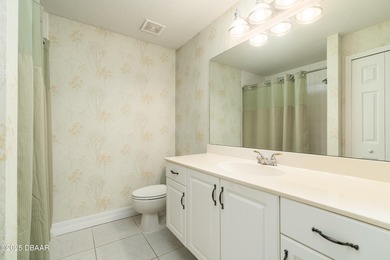 Experience the essence of refined Florida living in this on Spruce Creek Golf Club in Florida - for sale on GolfHomes.com, golf home, golf lot