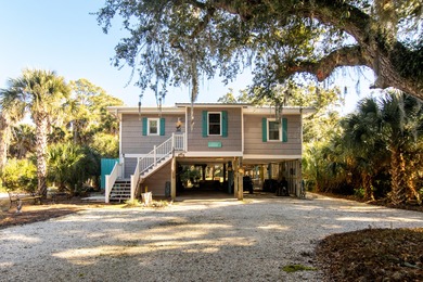 Charming and beautifully updated coastal cottage blending on The Plantation Course At Edisto in South Carolina - for sale on GolfHomes.com, golf home, golf lot