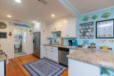 Charming and beautifully updated coastal cottage blending on The Plantation Course At Edisto in South Carolina - for sale on GolfHomes.com, golf home, golf lot