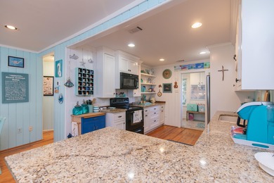 Charming and beautifully updated coastal cottage blending on The Plantation Course At Edisto in South Carolina - for sale on GolfHomes.com, golf home, golf lot