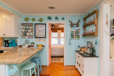 Charming and beautifully updated coastal cottage blending on The Plantation Course At Edisto in South Carolina - for sale on GolfHomes.com, golf home, golf lot