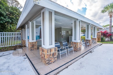 Experience the essence of refined Florida living in this on Spruce Creek Golf Club in Florida - for sale on GolfHomes.com, golf home, golf lot