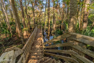 Experience the essence of refined Florida living in this on Spruce Creek Golf Club in Florida - for sale on GolfHomes.com, golf home, golf lot
