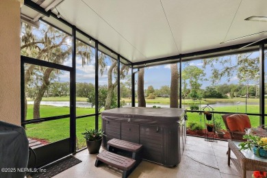 Overlooking the 11th hole, this Earl Whitehurst-built home on Hidden Hills Country Club in Florida - for sale on GolfHomes.com, golf home, golf lot