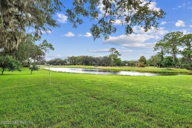 Overlooking the 11th hole, this Earl Whitehurst-built home on Hidden Hills Country Club in Florida - for sale on GolfHomes.com, golf home, golf lot