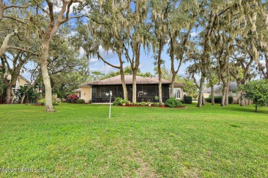 Overlooking the 11th hole, this Earl Whitehurst-built home on Hidden Hills Country Club in Florida - for sale on GolfHomes.com, golf home, golf lot