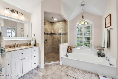 Overlooking the 11th hole, this Earl Whitehurst-built home on Hidden Hills Country Club in Florida - for sale on GolfHomes.com, golf home, golf lot