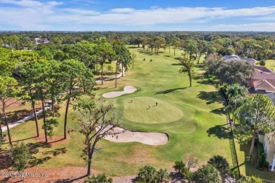Overlooking the 11th hole, this Earl Whitehurst-built home on Hidden Hills Country Club in Florida - for sale on GolfHomes.com, golf home, golf lot