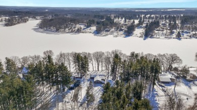 Welcome to this picturesque lakeside retreat, nestled on the on Spruce Ridge Golf Club in Michigan - for sale on GolfHomes.com, golf home, golf lot