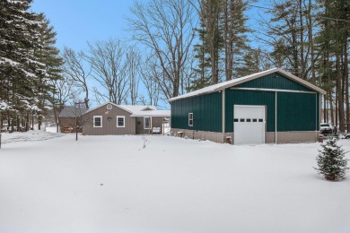 Welcome to this picturesque lakeside retreat, nestled on the on Spruce Ridge Golf Club in Michigan - for sale on GolfHomes.com, golf home, golf lot