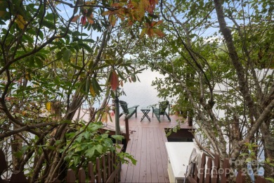 Situated on beautiful Lake Ticoa in the gated community of on Connestee Falls Golf Club in North Carolina - for sale on GolfHomes.com, golf home, golf lot