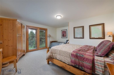 This charming log home, nestled in the trees and perched above on Big Sky of Montana Golf Course in Montana - for sale on GolfHomes.com, golf home, golf lot
