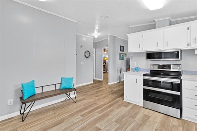 Discover this beautifully updated split-bedroom home featuring on Barefoot Bay Golf Course in Florida - for sale on GolfHomes.com, golf home, golf lot