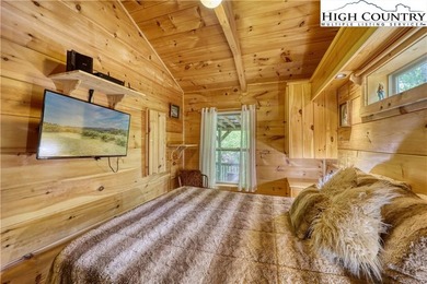 One bedroom, one bath Green River Log Cabin located in the on Land Harbor Golf Course in North Carolina - for sale on GolfHomes.com, golf home, golf lot