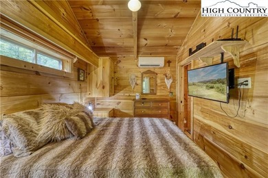 One bedroom, one bath Green River Log Cabin located in the on Land Harbor Golf Course in North Carolina - for sale on GolfHomes.com, golf home, golf lot