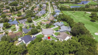 Tucked away on a quiet cul-de-sac and backing onto the lush on  in Florida - for sale on GolfHomes.com, golf home, golf lot