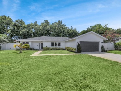 Tucked away on a quiet cul-de-sac and backing onto the lush on  in Florida - for sale on GolfHomes.com, golf home, golf lot