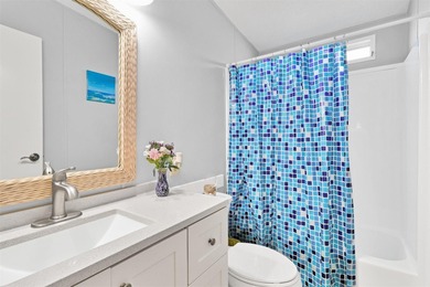 Discover this beautifully updated split-bedroom home featuring on Barefoot Bay Golf Course in Florida - for sale on GolfHomes.com, golf home, golf lot