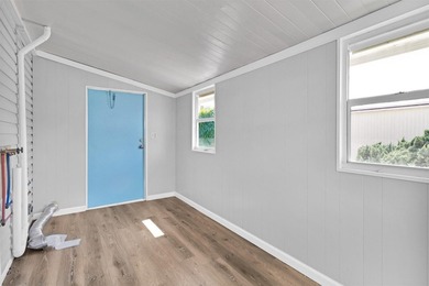 Discover this beautifully updated split-bedroom home featuring on Barefoot Bay Golf Course in Florida - for sale on GolfHomes.com, golf home, golf lot