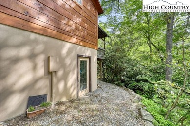 One bedroom, one bath Green River Log Cabin located in the on Land Harbor Golf Course in North Carolina - for sale on GolfHomes.com, golf home, golf lot