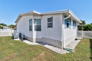 Discover this beautifully updated split-bedroom home featuring on Barefoot Bay Golf Course in Florida - for sale on GolfHomes.com, golf home, golf lot