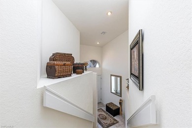 Rarely available end-unit condo with attached garage offering on Imperial Golf Club in Florida - for sale on GolfHomes.com, golf home, golf lot