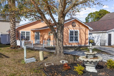 This inviting single-level three-bedroom, two-bath beach home is on Whispering Pines in South Carolina - for sale on GolfHomes.com, golf home, golf lot