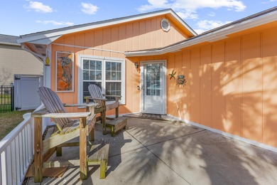 This inviting single-level three-bedroom, two-bath beach home is on Whispering Pines in South Carolina - for sale on GolfHomes.com, golf home, golf lot