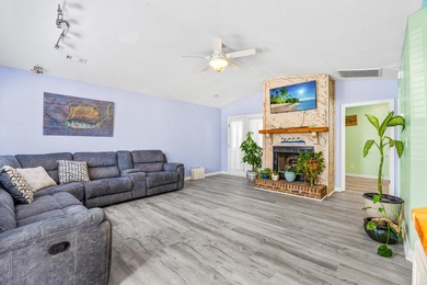 This inviting single-level three-bedroom, two-bath beach home is on Whispering Pines in South Carolina - for sale on GolfHomes.com, golf home, golf lot