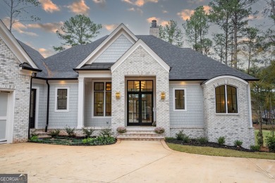 This meticulous custom golf residence is impeccably built with on Reynolds Lake Oconee - The Oconee in Georgia - for sale on GolfHomes.com, golf home, golf lot