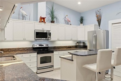 Wake up each day to million-dollar waterfront views overlooking on Saint Andrews South Golf Club in Florida - for sale on GolfHomes.com, golf home, golf lot