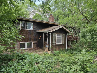 Rare opportunity! This 3 bed, 2 bath fixer-upper sits on over 2 on Baraboo Country Club in Wisconsin - for sale on GolfHomes.com, golf home, golf lot
