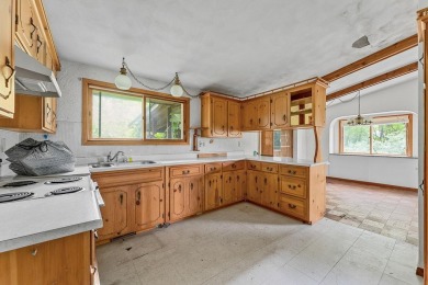 Rare opportunity! This 3 bed, 2 bath fixer-upper sits on over 2 on Baraboo Country Club in Wisconsin - for sale on GolfHomes.com, golf home, golf lot
