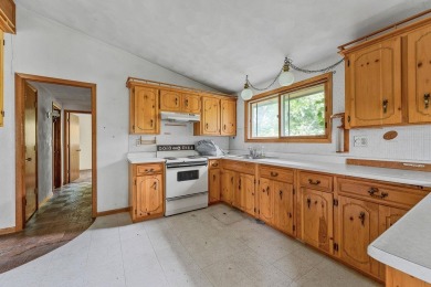 Rare opportunity! This 3 bed, 2 bath fixer-upper sits on over 2 on Baraboo Country Club in Wisconsin - for sale on GolfHomes.com, golf home, golf lot