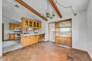 Rare opportunity! This 3 bed, 2 bath fixer-upper sits on over 2 on Baraboo Country Club in Wisconsin - for sale on GolfHomes.com, golf home, golf lot