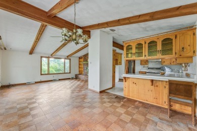 Rare opportunity! This 3 bed, 2 bath fixer-upper sits on over 2 on Baraboo Country Club in Wisconsin - for sale on GolfHomes.com, golf home, golf lot
